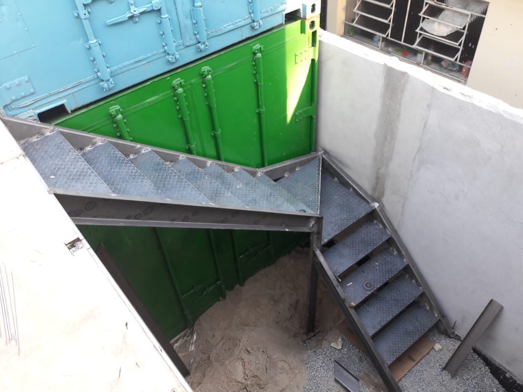 New steel staircase connecting the container floors